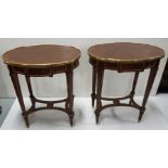 Matching Pair of Oval-Shaped Occasional Tables with brass galleries and stretcher shelves, in the