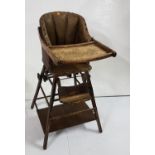 Child’s 1930’s Highchair, with brown leather seat and back, lift-up tray