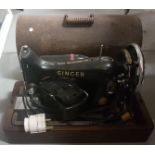Electric Singer hand sewing machine in case