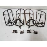 Set of 8 early 20th C cast iron saddle racks, painted black (no bridle holders)