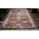 Red ground Caucasian Carpet, with a beautiful all-over medallion design, green highlights, 1.92m x