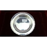London Silver Bottle Stand with scroll embossed border, initialled G.K.S.17cm dia, 170 grams,
