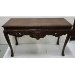 Irish mahogany Chippendale rectangular shaped side table with roped edge top over mask front, carved