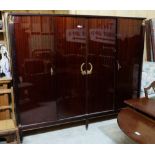 Italian 4 -door wardrobe, 87"w x 72"h x 23.5"d (matches lot 603), featuring classic early Egyptian