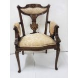 Edwardian mahogany and decoratively Inlaid armchair with sprung seat, sabre front legs