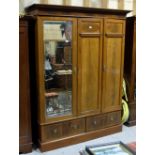 Edwardian mahogany 3 door wardrobe with mirrored door enclosing 3 sliding shelves, 2 drawers below