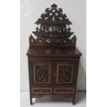 Asian Rosewood and Teak heavily carved miniature Bookcase, 2 mirror backed doors enclosing 6