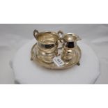 Three Piece Irish Silver Service – incl. a sugar bowl (5.5”w), milk jug (3”h) and a circular tray