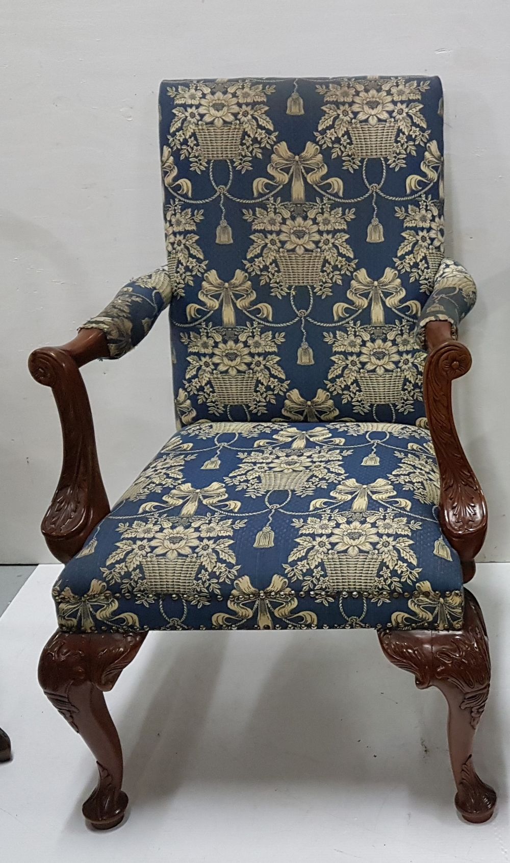 Matching of reproduction Mahogany Open Armchairs, on ball and claw feet, navy and gold fabric