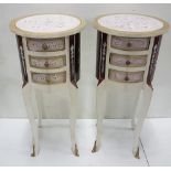 Matching Pair of narrow circular Cabinets, painted white and with floral décor, each 35cm dia x 76cm