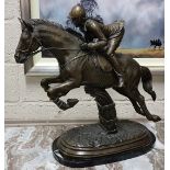 BRONZE SCULPTURE “The Female Showjumper”, on an oval black marble base, 61cmH x 50cmW
