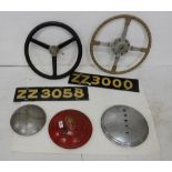 2 vintage car steering wheels, 3 hub caps – Buick, Ford, Hupmobile and 2 “ZZ” car registration