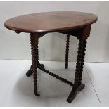 Small sized Mahogany Sutherland Table with bobbin twist stretcher and fold out legs, castors, 20”