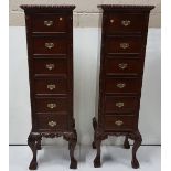 Matching pair of reproduction mahogany tallboys, 6 drawers, ball and claw feet, each 17”w x 55”h x