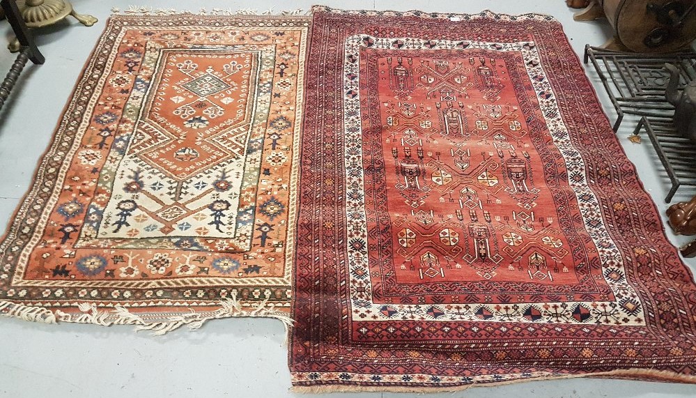 2 floor rugs – one red ground 1.64m x 1.1m & 1 other later rug