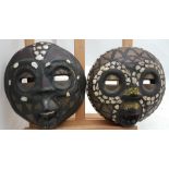 Pair of craved African Matrimonial Male and Female Masks, each 9”w x 9”h, decorated with shells