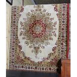 Kashmir Floor Rug, gold ground with red floral features, 2.4 x 1.6m (as new)