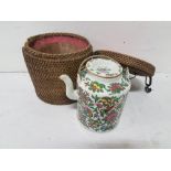 Japanese Teapot, decorated with pink flowers, butterflies, carrying handle and an original wicker