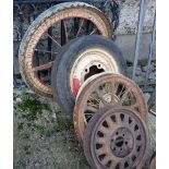 4 old car rims – one with a tyre and a “wheel of fortune” wheel (5)