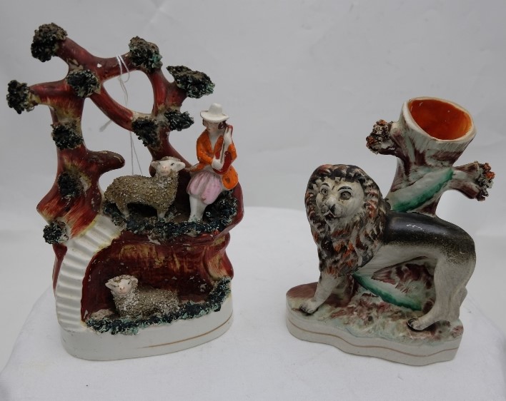 Two Victorian painted Staffordshire Table Figures – a Lion at tree stump (small chip on stump) w5” x