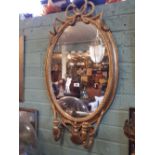 Regency oval gilt mirror in the Nelson Style. (113 cm H x 57 cm W).