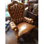 Pair of mahogany leather upholstered armchairs.