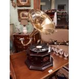 Gramophone with brass horn.