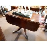 Georgian mahogany double drop leaf sofa table with turned column with four out swept brass feet.