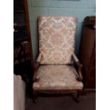 Victorian Carved walnut throne chair raised on cabriole legs.