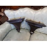 Pair of carved hardwood wall sconces.