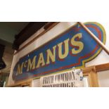 MC MANUS wooden shop sign.