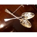 Pair of English silver berry dessert spoons bright cut design with gilded bowls embossed with