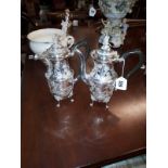 Irish silver coffee pot and water jug of baluster shape decorated with crisply chased scrolls,