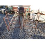 Pair of decorative metal garden tables with glass tops.