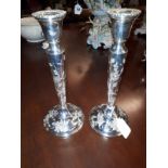 Pair of Irish silver candlesticks decorated with Flowers and foliage. Hallmarked in Dublin 1978.