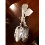 Set of six English silver table spoons in the popular fiddle pattern with monogram W.