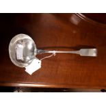 Irish silver soup ladle in the popular fiddle pattern crested. Weight 190 grams, 6.1 troy ounces.