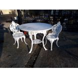 Three piece cast iron and marble garden set.