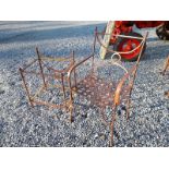 Decorative metal garden armchairs with cushion and decorative metal garden table with glass top.