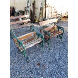 Pair of cast iron garden chairs with wooden slats.