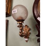 Pair of early 20th. C. gilded brass wall ensconces with football glass shades.