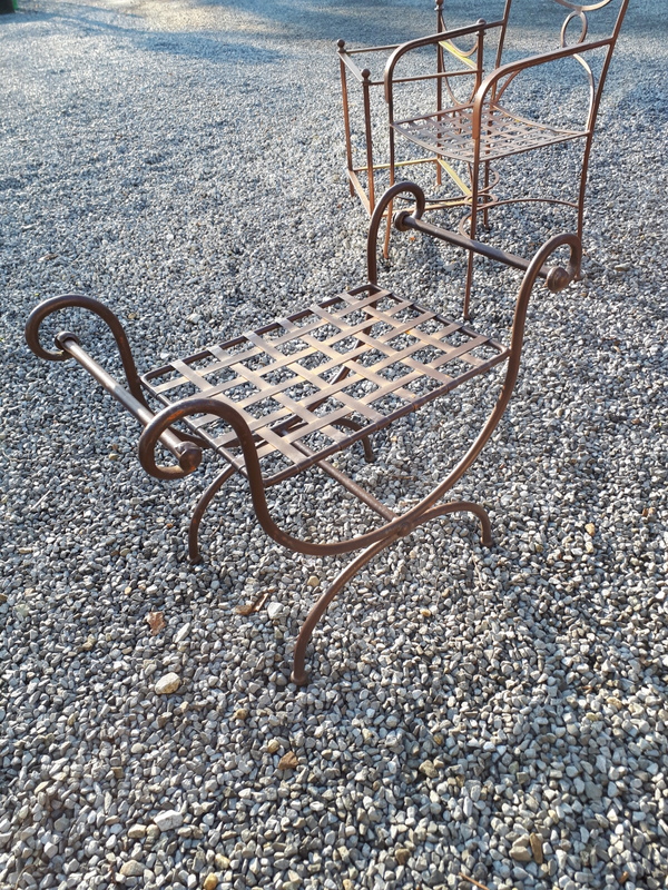 Decorative metal stool of lyre form.