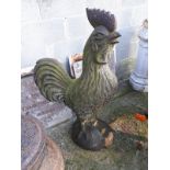 Cast iron model of a rooster.