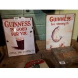 Two Guinness plate advertising signs.