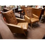 Pair of 1960's leather upholstered armchairs.