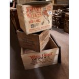 Three wooden advertising boxes - Johnnie Walker, J Haig Scotch Whiskey and Dewar's.