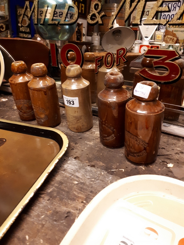 Five early 19th. C. stoneware Schweppes Purveyors To The King ginger beer bottles.
