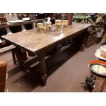 19th. C. oak refectory table raised on turned legs with single stretcher.