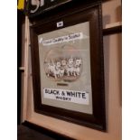 Framed Black & White Scotch Whiskey advertising print.