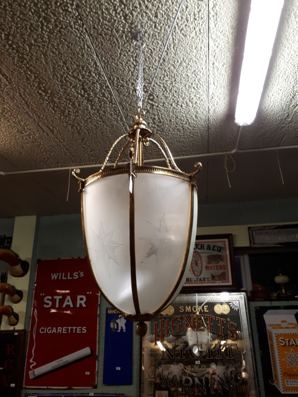 Decorative brass and etched glass lantern in the form of an acorn.